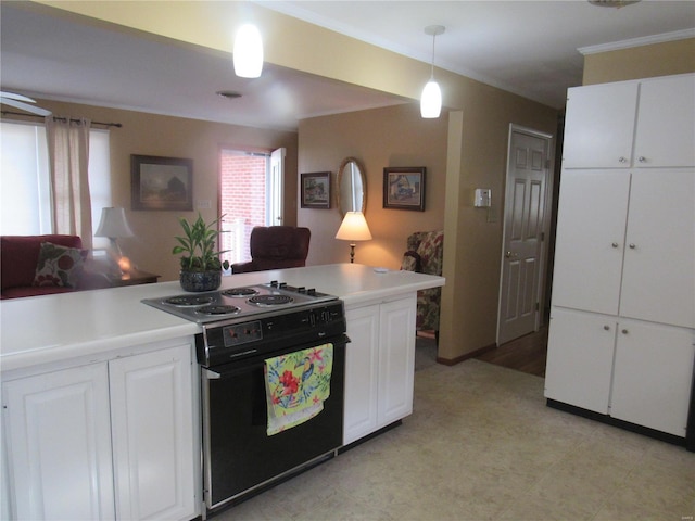 kitchen featuring black range with electric cooktop, white cabinetry, and hanging light fixtures