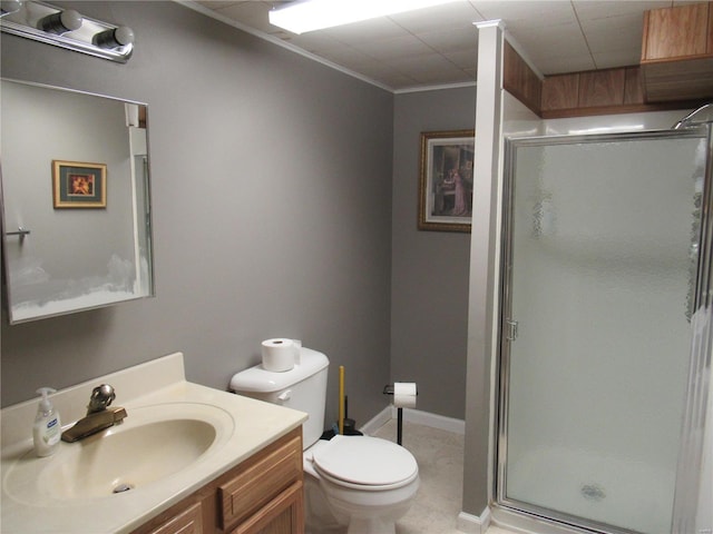 bathroom featuring vanity, toilet, and a shower with shower door