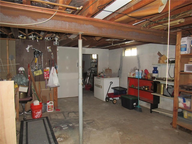 basement with white fridge