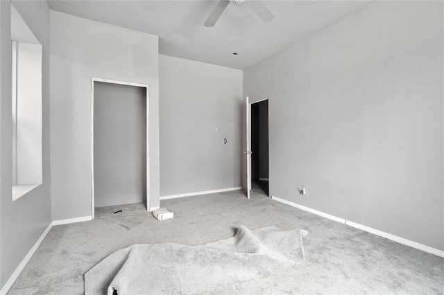 unfurnished bedroom with light colored carpet and ceiling fan