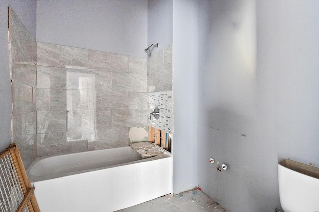 bathroom featuring toilet and tile patterned flooring