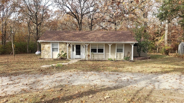 view of front facade featuring a porch and stone siding