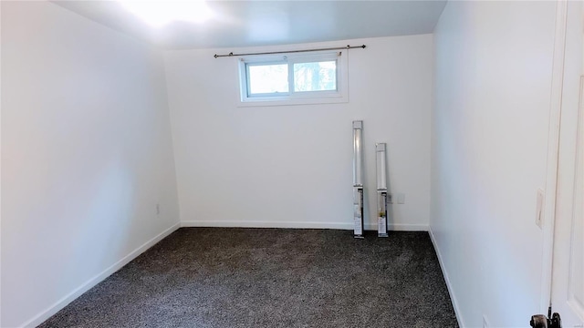 basement featuring baseboards and carpet