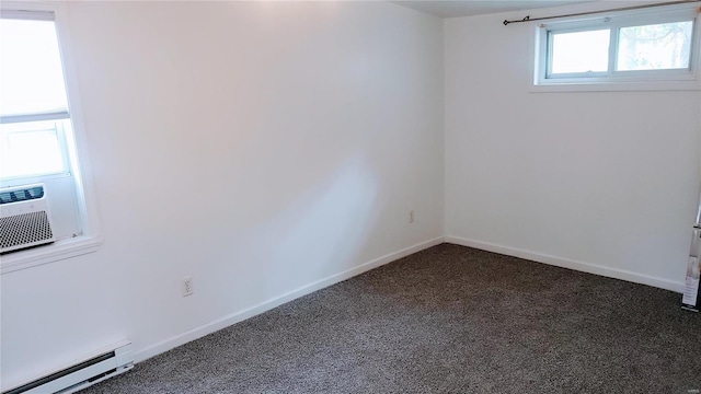unfurnished room featuring dark colored carpet, baseboards, cooling unit, and a baseboard radiator