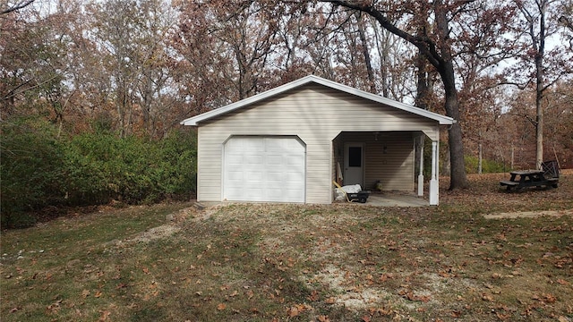 garage featuring a yard