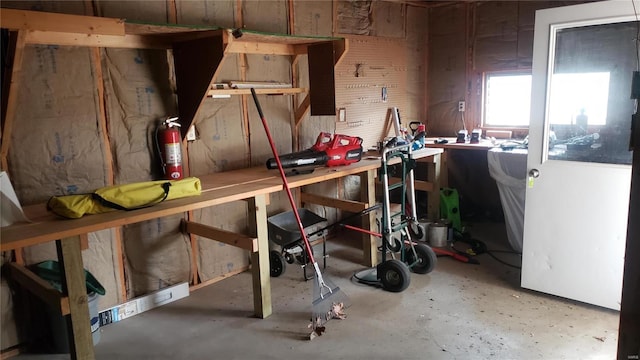interior space featuring concrete floors and a workshop area