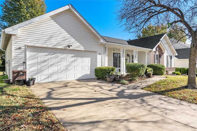 view of front of property featuring a garage and a porch