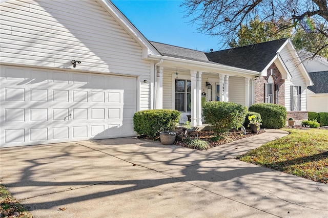 view of side of property with a garage and a porch