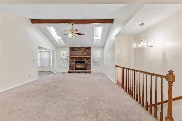 unfurnished living room with carpet flooring, a fireplace, and beam ceiling