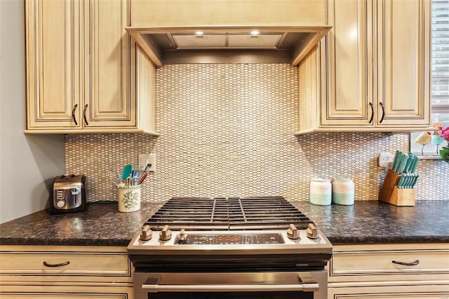 kitchen featuring custom exhaust hood and stainless steel range