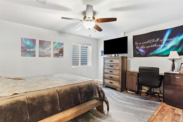 bedroom featuring ceiling fan and hardwood / wood-style floors