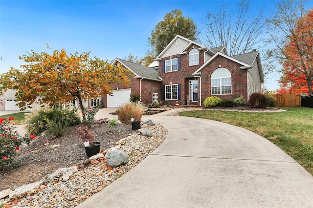 view of front property with a front lawn and a garage