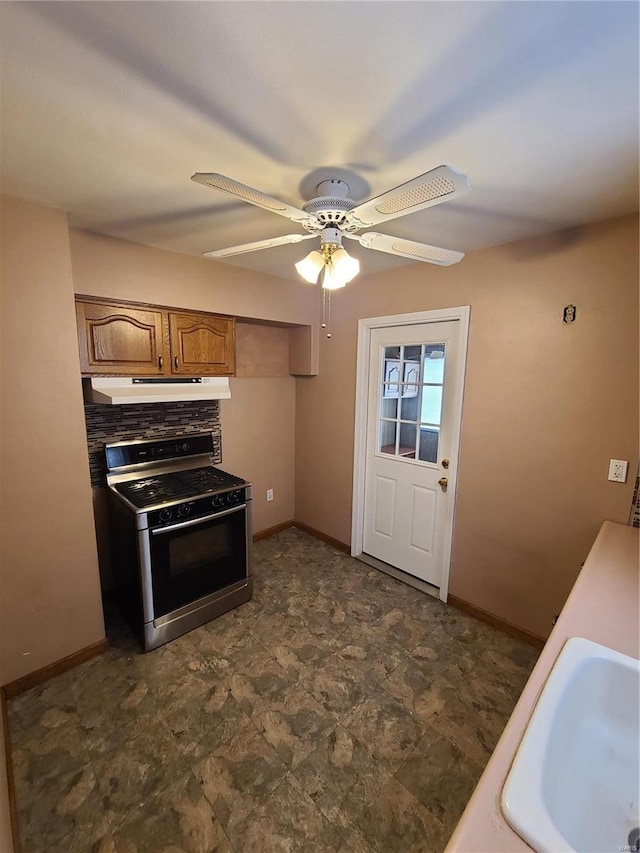 kitchen with ceiling fan, sink, and stainless steel range