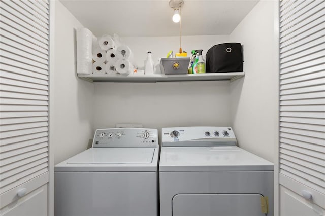 clothes washing area featuring washing machine and clothes dryer