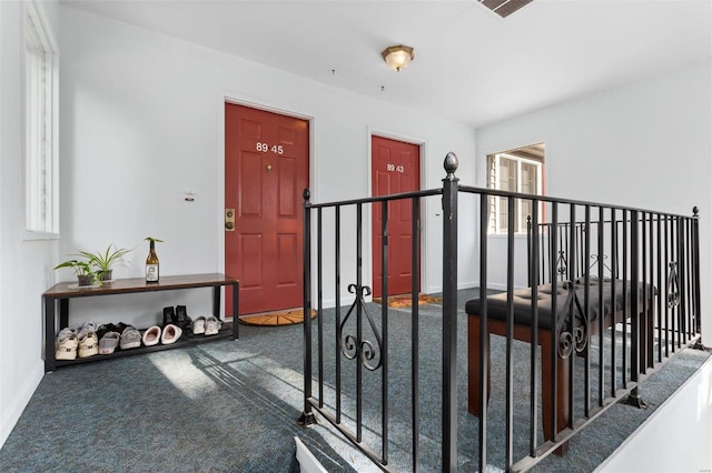 hallway with carpet flooring