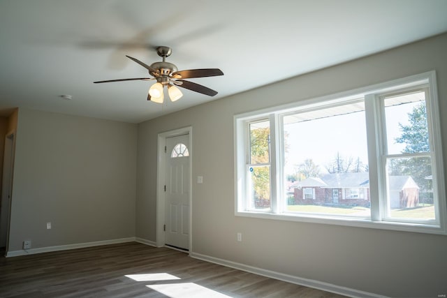 entryway with dark hardwood / wood-style floors and ceiling fan