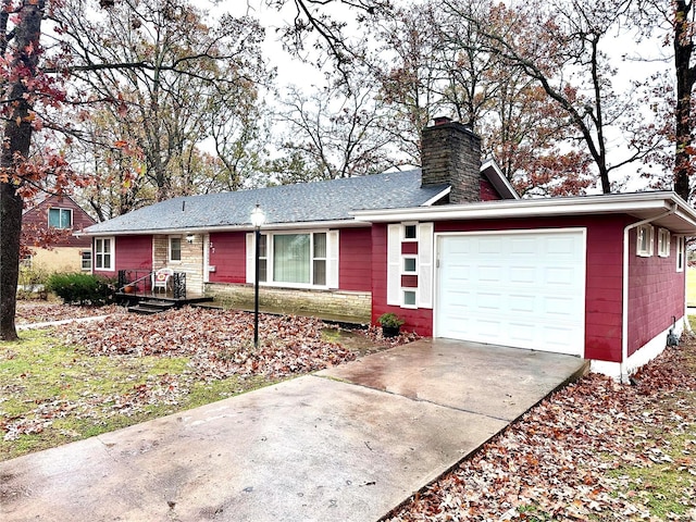 ranch-style home featuring a garage