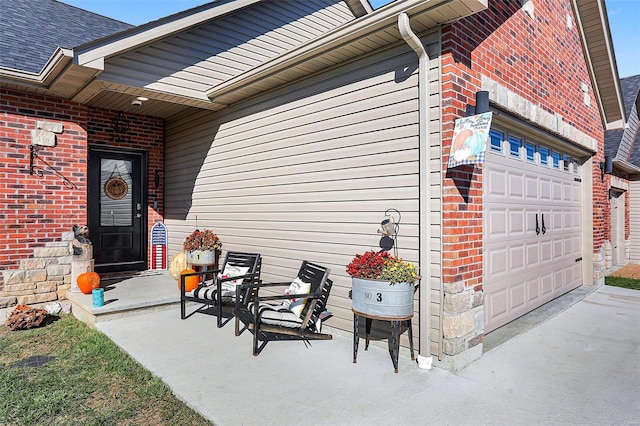 view of exterior entry featuring a garage