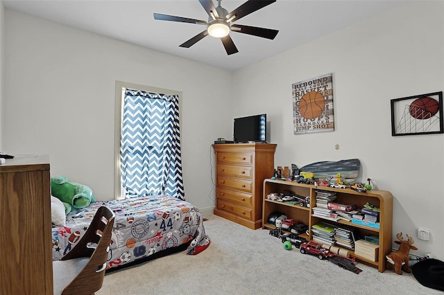 carpeted bedroom with ceiling fan