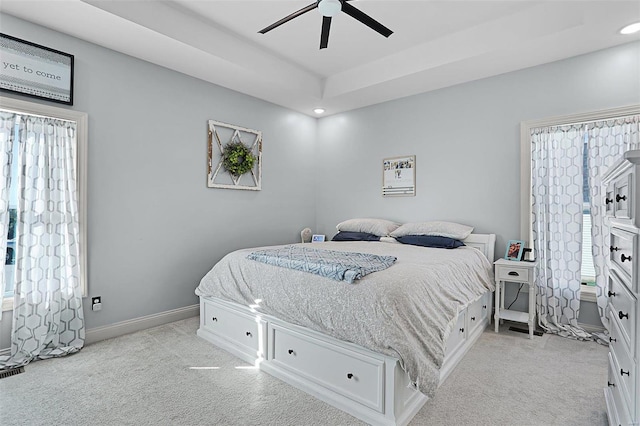 bedroom with light carpet and ceiling fan