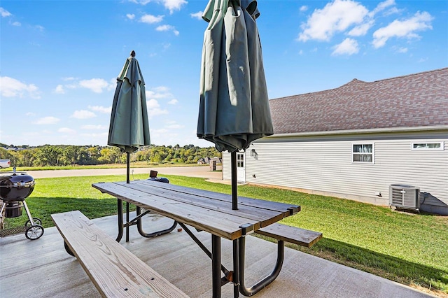 exterior space featuring a patio area and a lawn