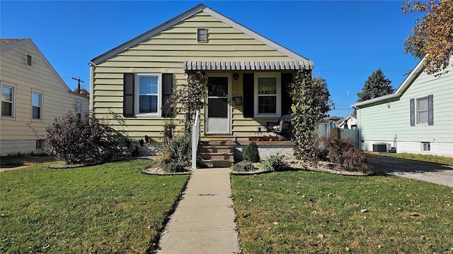 bungalow-style house featuring a front yard