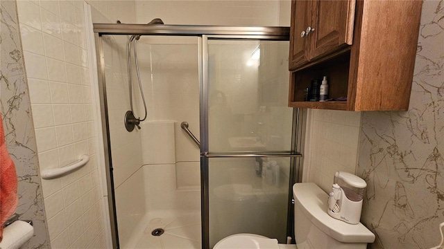 bathroom featuring toilet and walk in shower