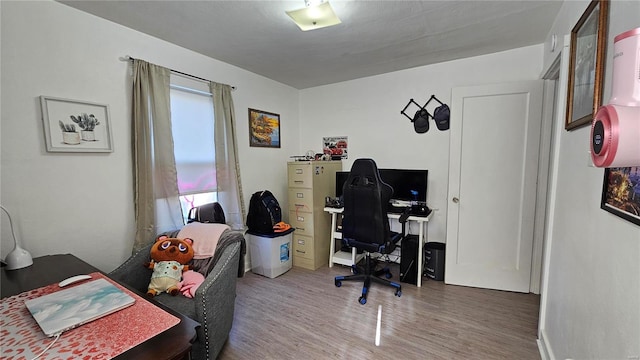 office area with hardwood / wood-style floors