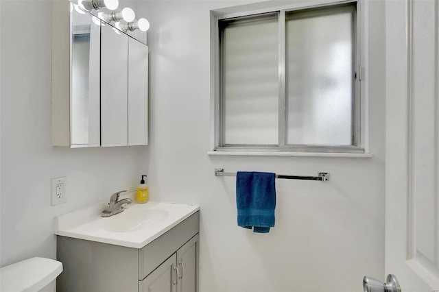 bathroom with vanity and toilet