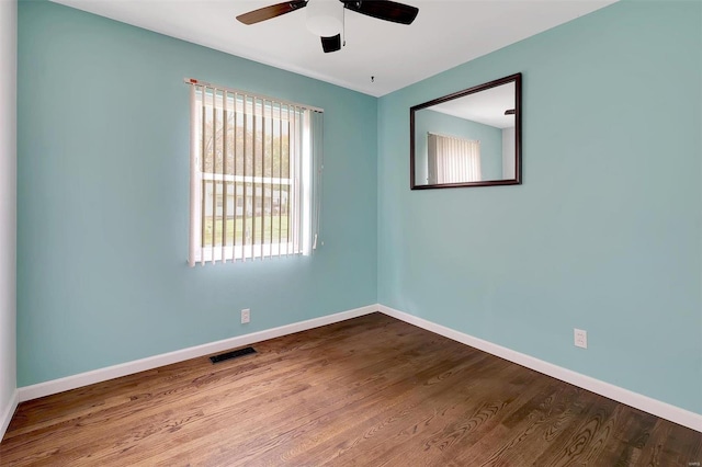 empty room featuring wood-type flooring and ceiling fan