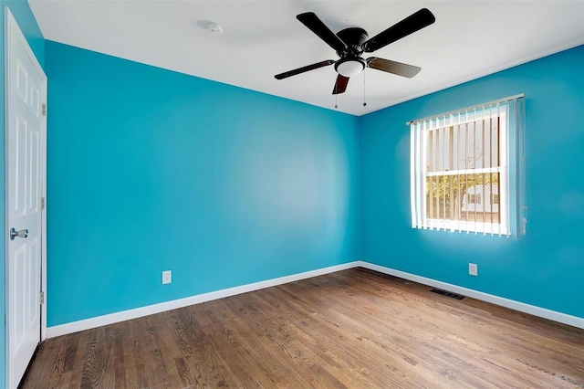 empty room featuring light wood-type flooring and ceiling fan