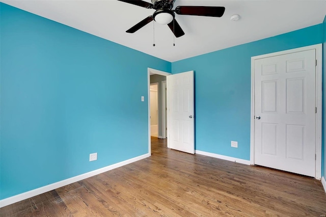 unfurnished bedroom with wood-type flooring and ceiling fan