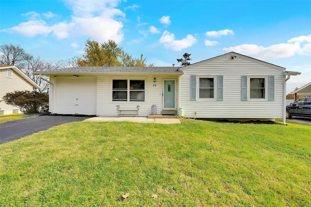 ranch-style home with a garage and a front yard