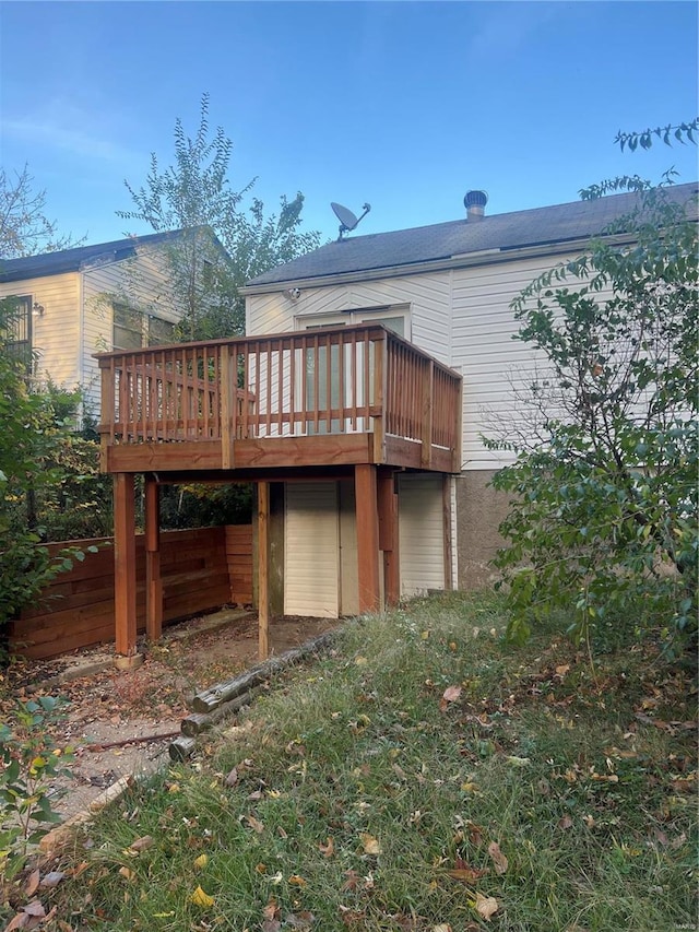 rear view of house featuring a deck