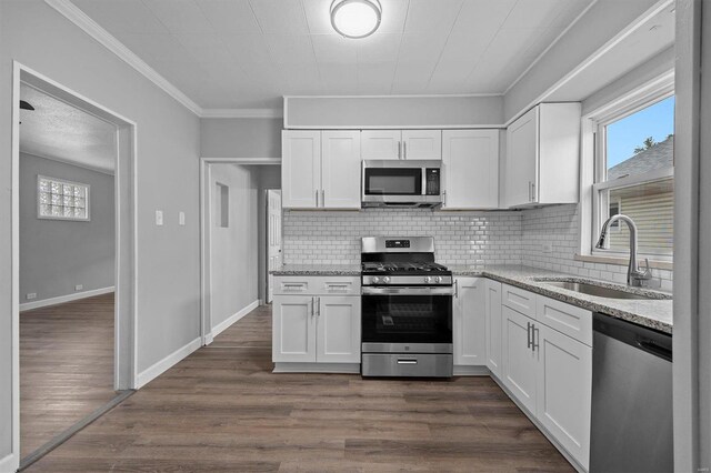 kitchen featuring white cabinetry, appliances with stainless steel finishes, and sink