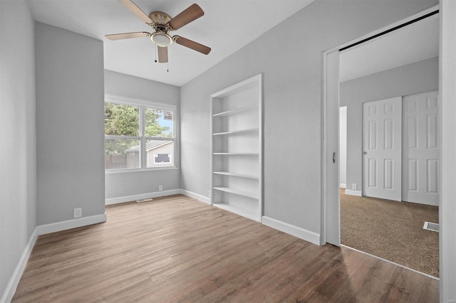 unfurnished bedroom featuring ceiling fan and hardwood / wood-style floors