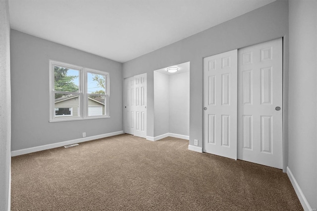 unfurnished bedroom featuring carpet flooring