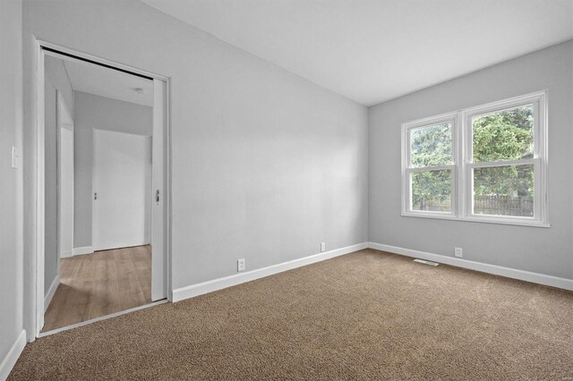 spare room with carpet floors