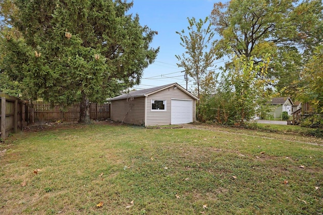 view of yard with an outdoor structure and a garage