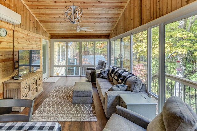 sunroom with an AC wall unit, plenty of natural light, wooden ceiling, and lofted ceiling