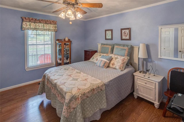 bedroom featuring ceiling fan, dark hardwood / wood-style flooring, and ornamental molding