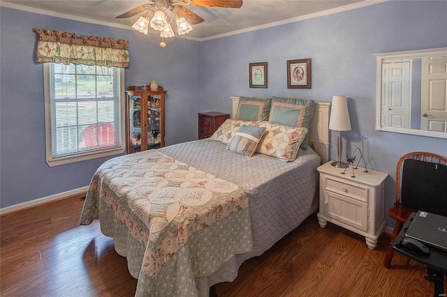 bedroom featuring ceiling fan, ornamental molding, and dark hardwood / wood-style flooring