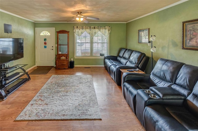 living room featuring crown molding, hardwood / wood-style floors, and ceiling fan