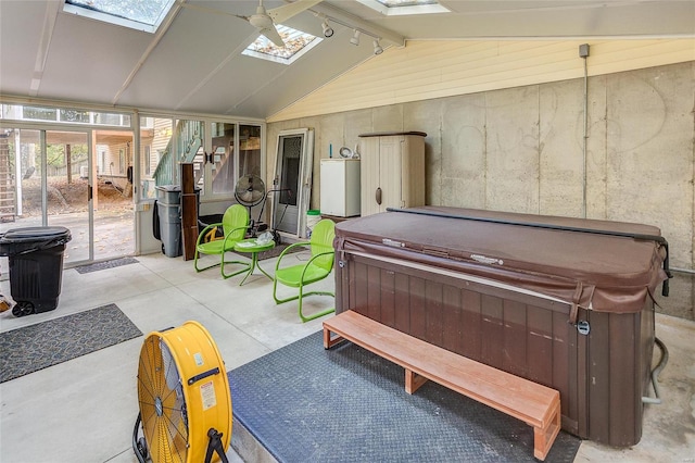 miscellaneous room featuring lofted ceiling with skylight