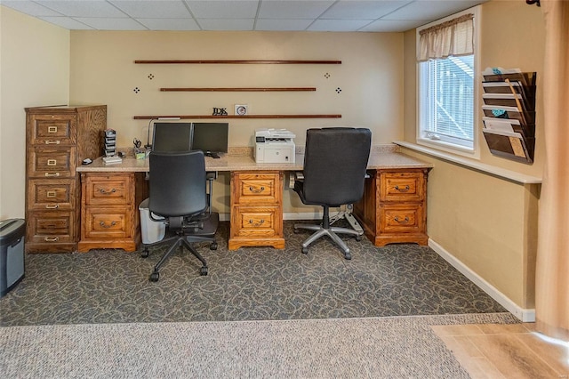 office with a paneled ceiling