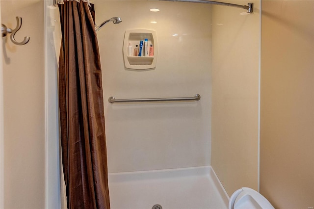 bathroom with a shower with curtain