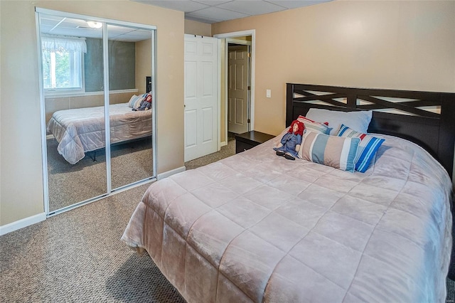 bedroom with a closet and carpet flooring