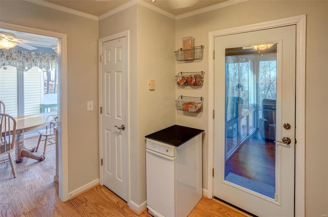 doorway to outside with light hardwood / wood-style floors, ornamental molding, and ceiling fan