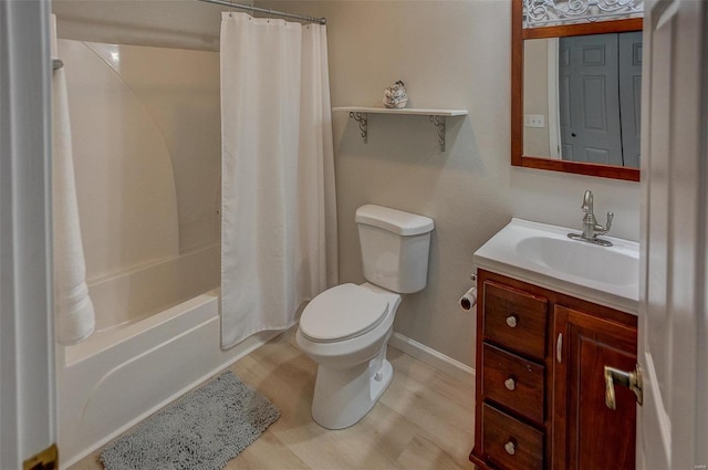 full bathroom featuring shower / bath combo, toilet, and vanity