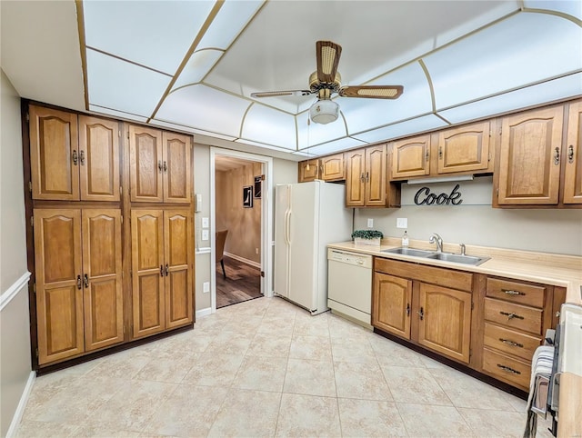 kitchen featuring light tile patterned flooring, ceiling fan, sink, and white appliances